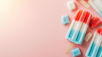 Colorful popsicles arranged artistically on a light pink background, perfect for summer treats or dessert inspiration. photo
