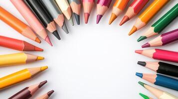 A vibrant arrangement of colorful pencils circling a blank space, perfect for creative projects and artistic expressions. photo