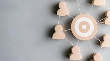 A network concept visual featuring connected figures and a target symbolizing collaboration and focus in business. photo