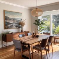 A sophisticated dining room that pairs a striking landscape painting with earth-toned decor and lush greenery, creating an elegant natural retreat. photo