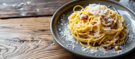 Boiled spaghetti with al dente level Cooked pasta prepared for cooking on white plate decorated with fresh parsley in side view copy space on wood table Homemade Italian traditional food concept photo