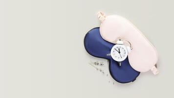 Masks for sleep, alarm clock with time for sleep and lavender flowers photo