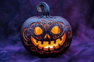 A beautifully carved pumpkin features an intricate design, illuminated from within, casting a warm glow in the dark setting. photo