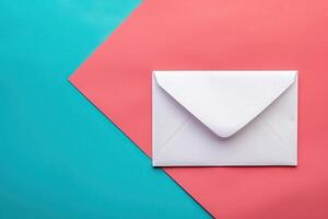A sleek white envelope rests on colorful backgrounds, featuring soft shades of pink and teal that evoke a modern and artistic feel. photo