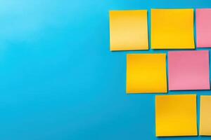 A dynamic gathering of minds as colorful sticky notes are arranged on a bright blue surface during a brainstorming session. photo