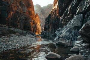 A river runs through a canyon with a rocky shoreline photo