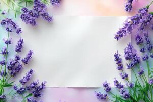 Lavender Flowers Surrounding a White Paper on a Pastel Background photo