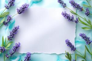 Lavender Flowers and Blank Paper on a Blue Background photo