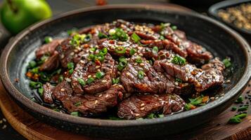 Seared Beef with Sesame Seeds and Green Onions in a Bowl photo