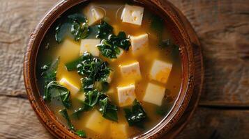 Close-up of Miso Soup with Tofu and Seaweed in a Bowl photo