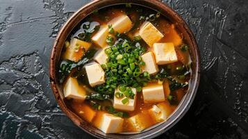 Bowl of Japanese Miso Soup with Tofu and Seaweed photo
