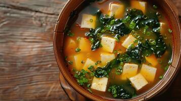 Bowl of Miso Soup with Tofu, Seaweed, and Green Onions photo