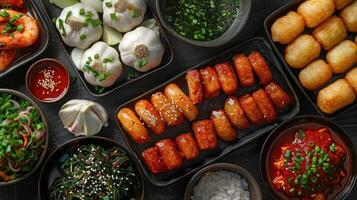 Assortment of Korean Dishes, Including Shrimp, Tofu, and Seaweed Salad photo