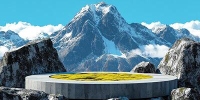 Concrete Platform with Yellow Grass and Snowy Mountains in the Background photo