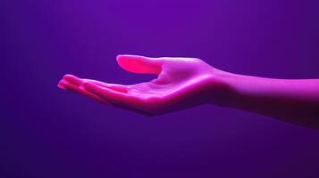 A Pink Hand Reaching Out Against a Purple Background photo
