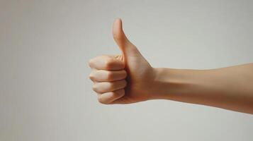 A Hand Giving a Thumbs Up Gesture photo