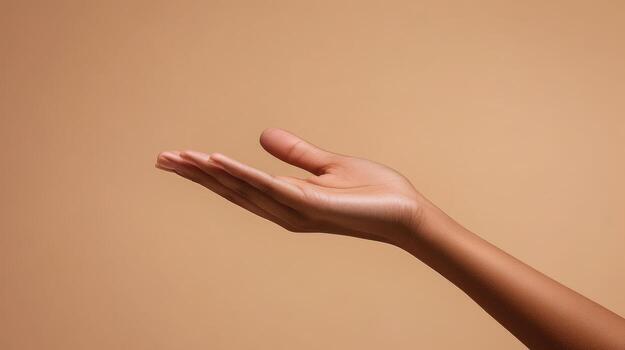Open Hand with Palm Up on a Beige Background photo