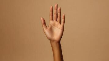 Close-up of a Person's Hand Raised with Palm Facing Forward photo