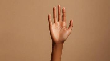 A close-up of a person's open palm with fingers extended photo