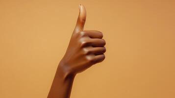 A Person's Hand Giving a Thumbs-Up Gesture photo