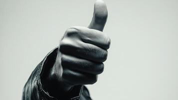Close-up of a Hand Giving a Thumbs-up Gesture photo