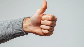 Close-up of a Hand Giving a Thumbs-Up Gesture photo