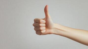 A Hand Giving a Thumbs Up Gesture photo