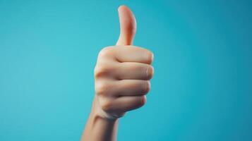 Close-up of a Hand Giving a Thumbs Up Gesture photo