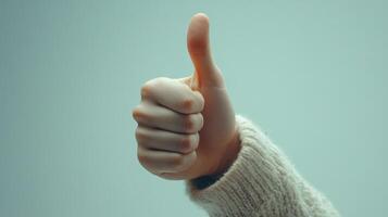 Close-up of a Hand Giving a Thumbs-Up Gesture photo