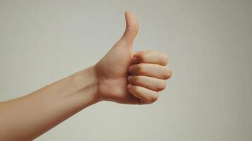 A Hand Giving a Thumbs Up Gesture photo