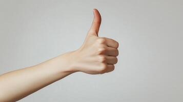 A Hand Gesturing Thumbs Up photo