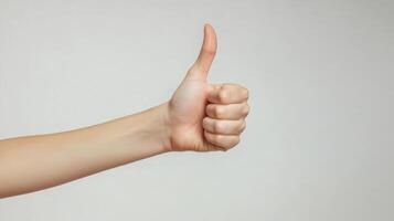 A Person's Hand Giving a Thumbs Up Gesture photo
