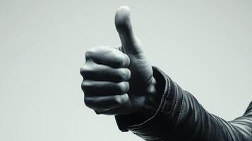 A Close-Up of a Hand Giving a Thumbs Up Gesture photo