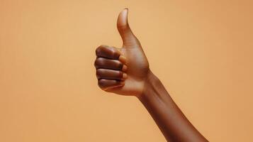 A Hand Giving a Thumbs Up Gesture photo