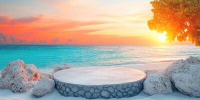 Stone Platform on a Sandy Beach at Sunset with a Tropical Tree photo