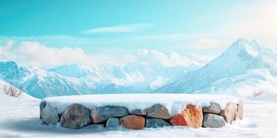 Snow-Covered Stone Wall Against a Snowy Mountain Range photo