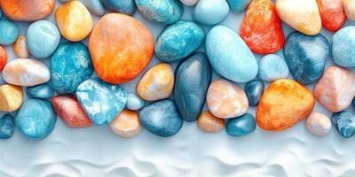 Smooth, Colorful Stones Arranged on White Surface photo