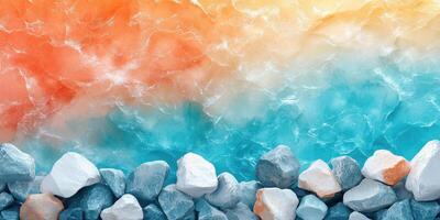 Smooth Stones by a Turquoise Ocean Under a Sunset Sky photo
