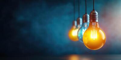 Illuminated Light Bulbs Hanging Against a Blue Background photo