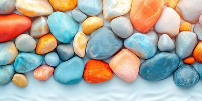 Colorful Smooth Stones on a White Surface photo