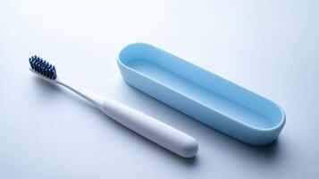 A blue toothbrush and holder on a plain white surface, arranged for a neat bathroom setting photo