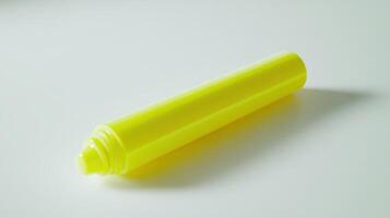 Bright yellow highlighter on a white surface during daytime photo