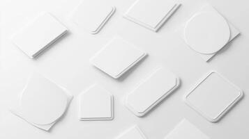 Flat lay of various blank paper shapes on a light surface photo