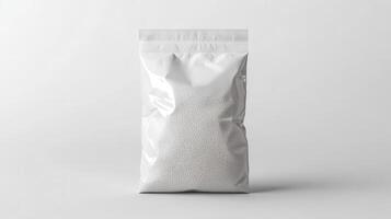 Clear plastic bag filled with small white beads on a plain background photo