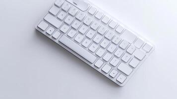 Minimalistic white keyboard on a light surface photo