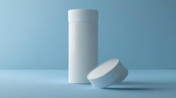 Plain white cylindrical container and lid on blue surface in a well-lit environment photo