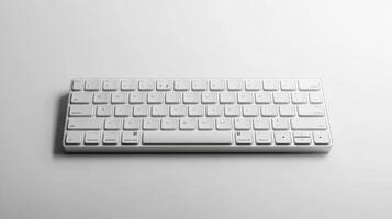 White wireless keyboard on a light surface, showcasing a modern design and compact layout photo