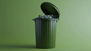 A green trash bin with an open lid filled with waste sits against a green background photo