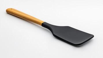 Black spatula with wooden handle isolated on a white background photo