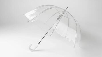 A clear umbrella with a curved handle positioned against a plain white background photo